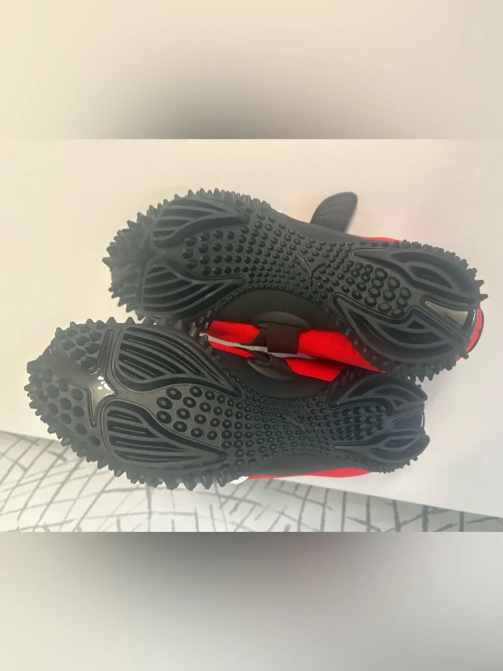 PUMA Mostro OG Sneakers. Vibrant  Red with a Unique Spike Sole.